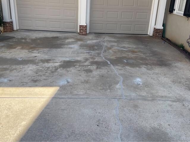 After sealed driveway crack near garage