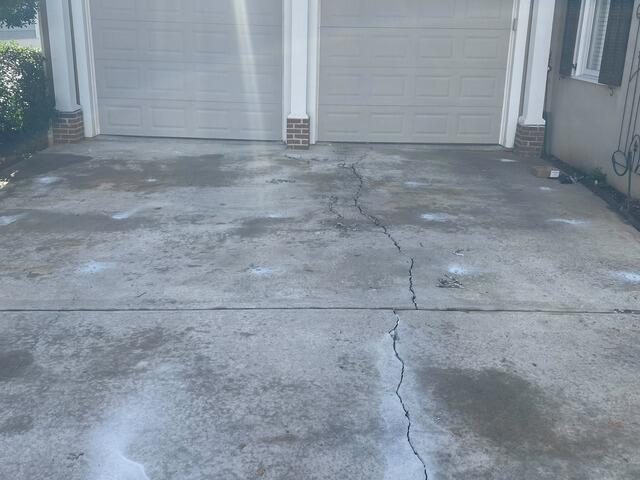 Before driveway crack near garage